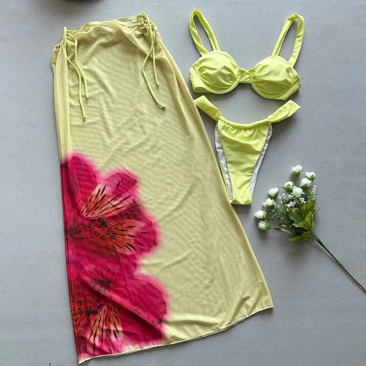 Fashionable 3-piece swimwear: bikini, long cover-up for vacation.